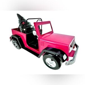 Little Red Metal Jeep With Decorated Christmas Tree In Back Home Office Decor